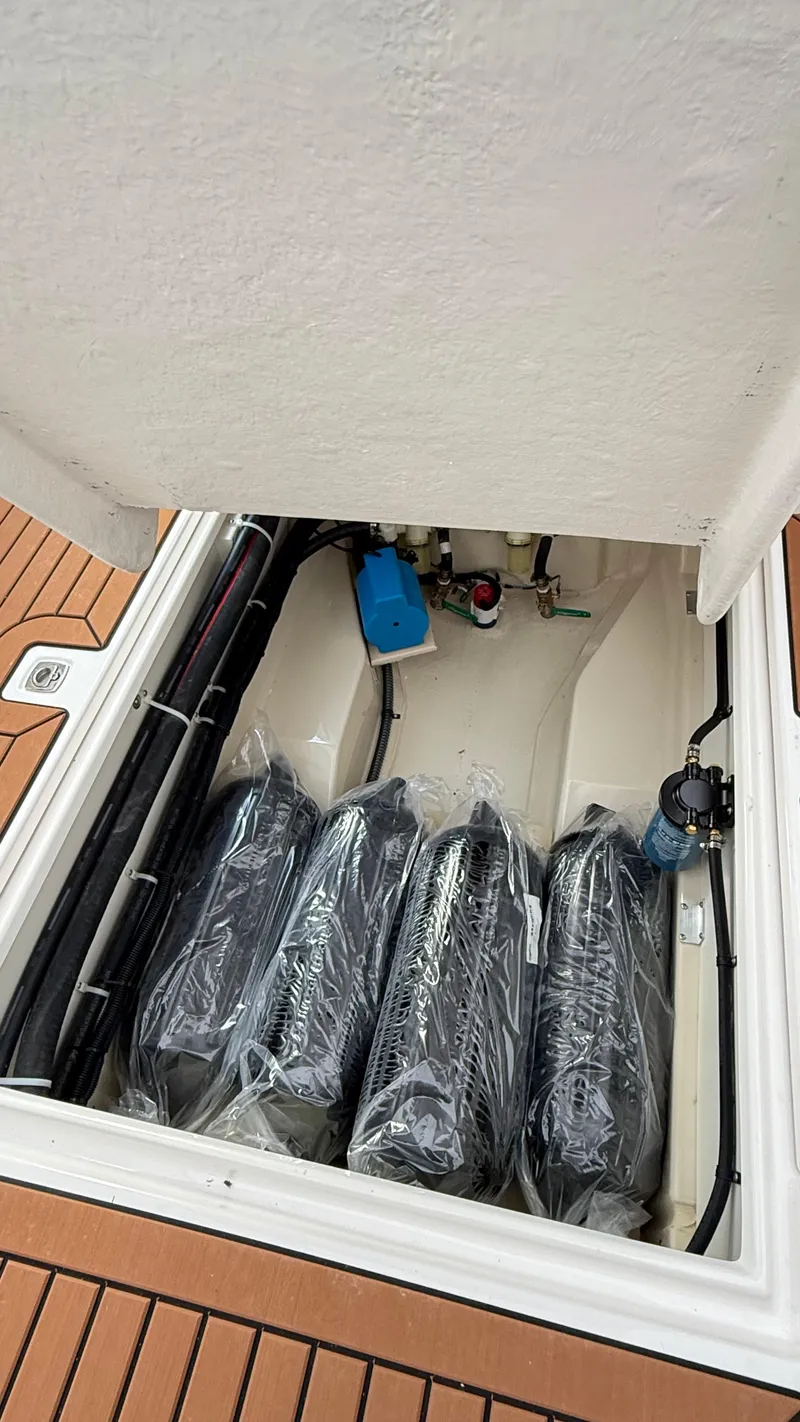 Slide: The Image of Storage compartment of 2026 Ranger Tugs R-27 boat with equipment and accessories. - 17