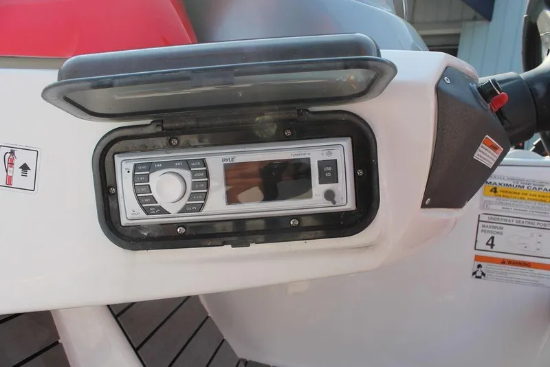 Slide: The Image of 2007 Sea-Doo Speedster 150 dashboard with Pyle audio system and safety instructions. - 7