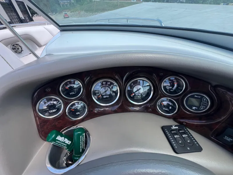 Slide: The Image of Dashboard of a 2006 Crownline 270 BR boat with gauges and controls. - 12