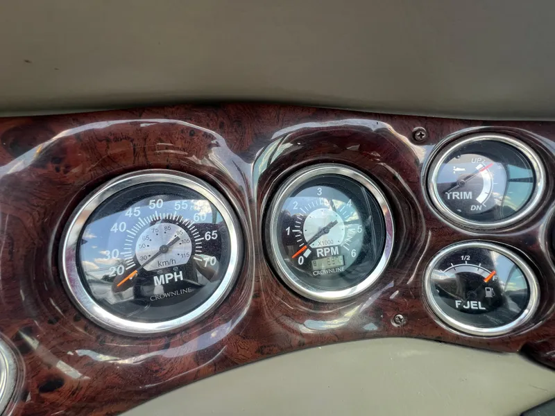Slide: The Image of Dashboard of a 2006 Crownline 270 BR boat with speedometer and RPM gauges. - 18