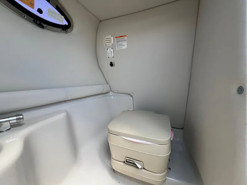 Slide: The Image of Compact marine toilet in 2006 Crownline 270 BR boat interior. - 20