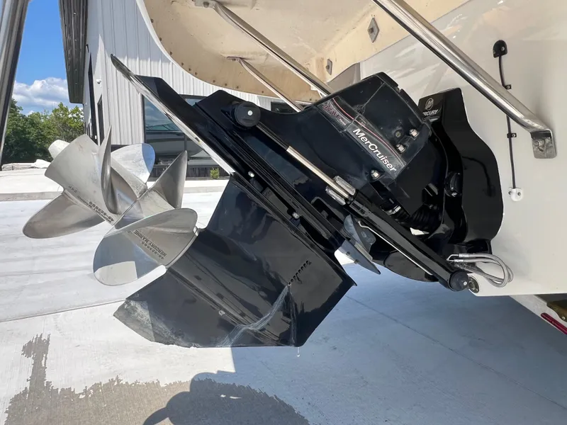 Slide: The Image of Close-up of a 2006 Crownline 270 BR boat's MerCruiser propeller and drive system. - 26