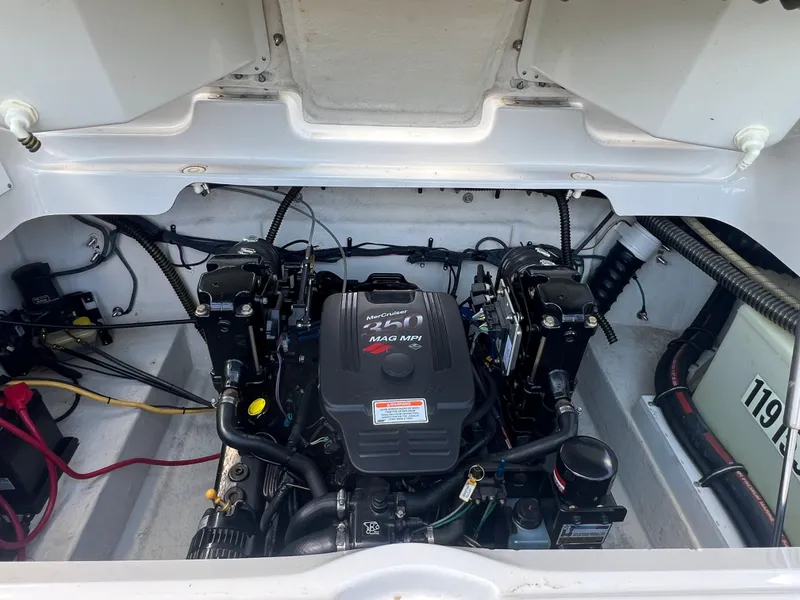 Slide: The Image of Engine compartment of a 2006 Crownline 270 BR boat, featuring a MerCruiser 350 MAG MPI. - 28