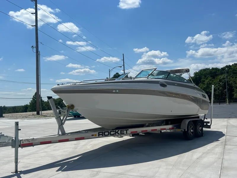 Slide: The Image of 2006 Crownline 270 BR boat on trailer under clear blue sky. - 5