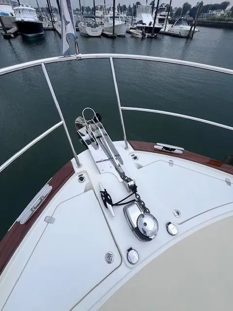 Slide: The Image of Bow of 2021 Sabre 45 Salon Express yacht docked in marina. - 18