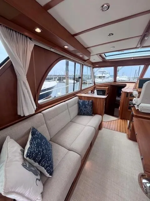 Slide: The Image of Interior of 2021 Sabre 45 Salon Express yacht with elegant wood finish and plush seating. - 21