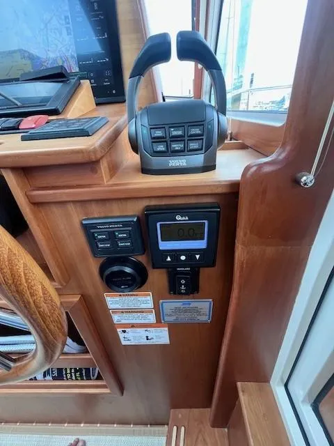Slide: The Image of Control panel of 2021 Sabre 45 Salon Express yacht with navigation equipment. - 34