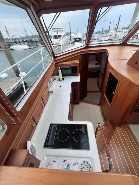 Slide: The Image of Interior of 2021 Sabre 45 Salon Express yacht with modern kitchen and marina view. - 39