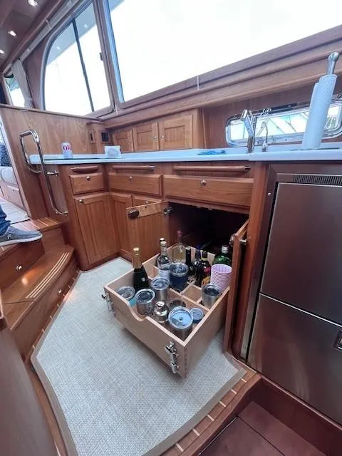 Slide: The Image of Luxurious 2021 Sabre 45 Salon Express yacht kitchen with pull-out beverage drawer. - 43