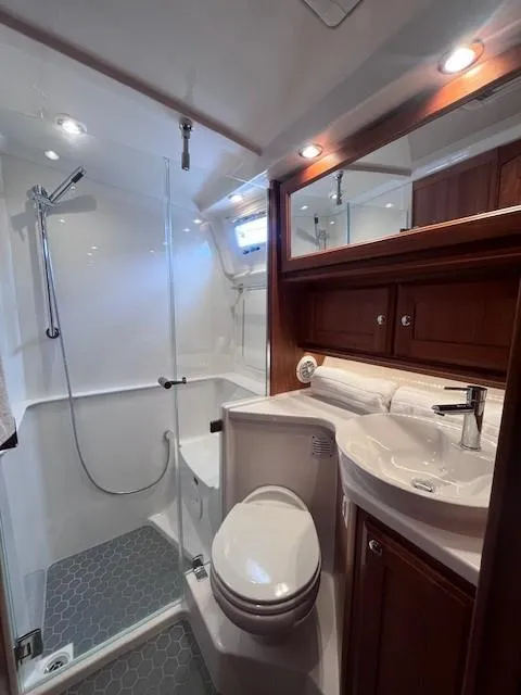 Slide: The Image of Luxurious bathroom in 2021 Sabre 45 Salon Express yacht with modern fixtures and elegant design. - 48
