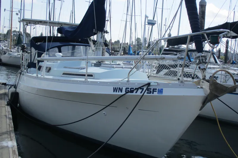 The Image of 1978 Moody 33 MkI sailboat docked at marina, surrounded by other boats. - 1