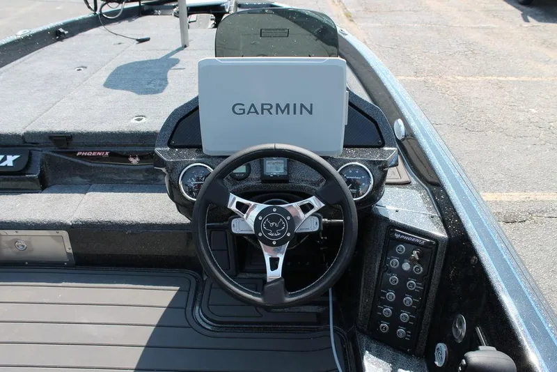 Slide: The Image of 2026 Phoenix 20 XE boat dashboard with Garmin navigation system and steering wheel. - 10