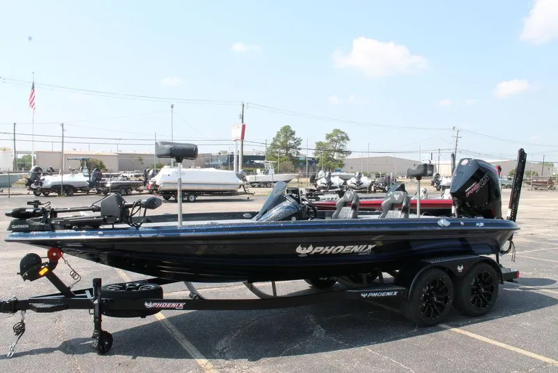 Slide: The Image of 2026 Phoenix 20 XE boat in parking lot, side view, with trailer and equipment. - 11