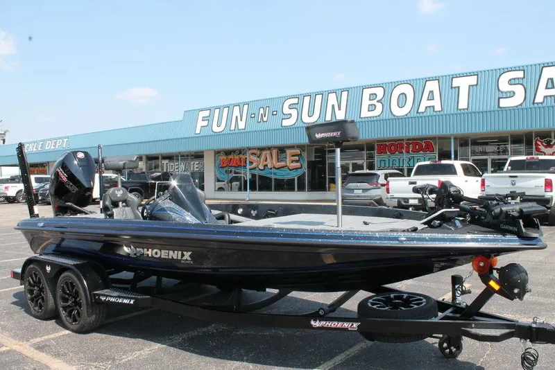 Slide: The Image of 2026 Phoenix 20 XE boat displayed at Fun-N-Sun Boat Sales dealership. - 3