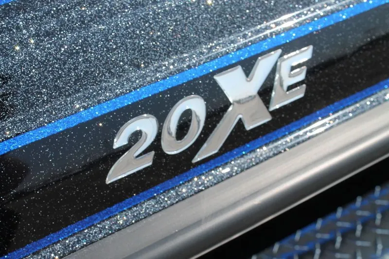 Slide: The Image of Phoenix 20 XE 2026 model emblem with glittery finish and blue accents. - 9