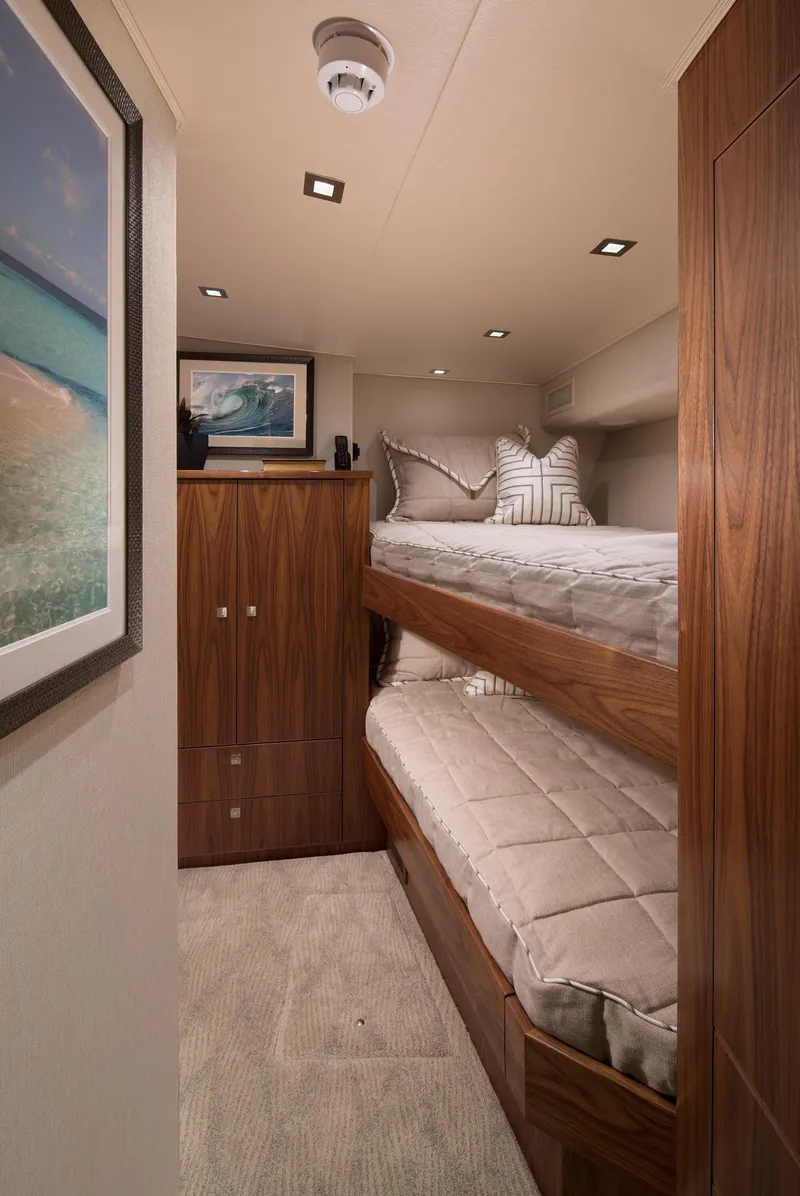Slide: The Image of Luxurious cabin interior with bunk beds in 2027 Viking 82 Skybridge yacht. - 11