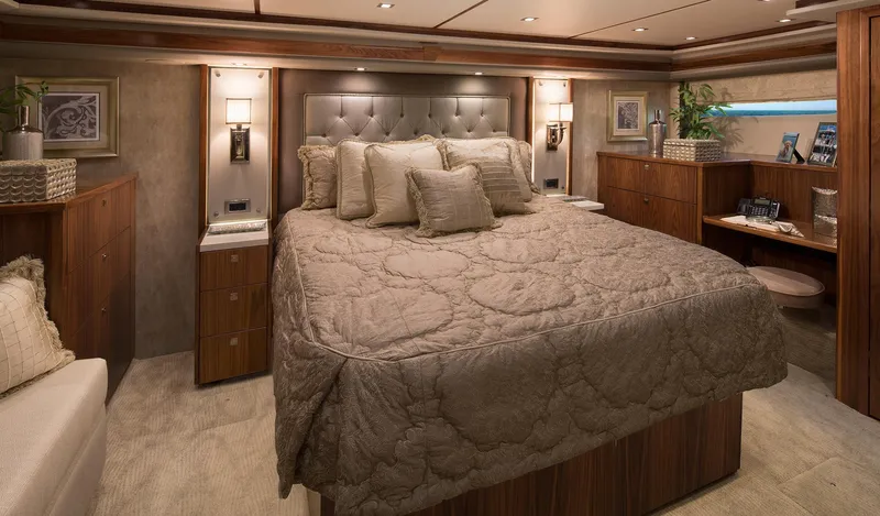 Slide: The Image of Luxurious bedroom interior of 2027 Viking 82 Skybridge yacht with elegant decor and plush bedding. - 14