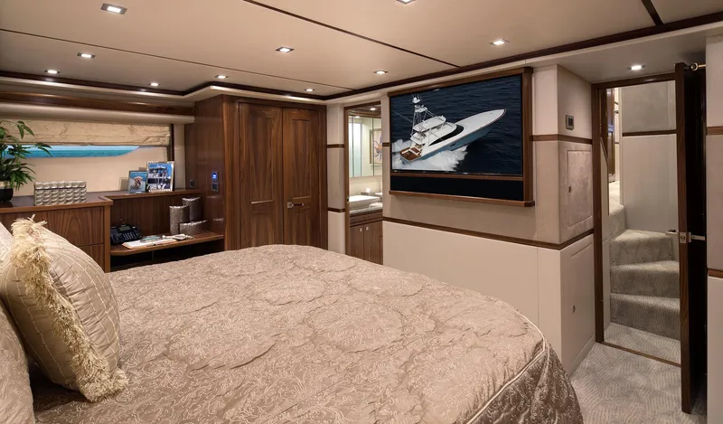 Slide: The Image of Luxurious bedroom interior of 2027 Viking 82 Skybridge yacht with elegant decor and modern amenities. - 16