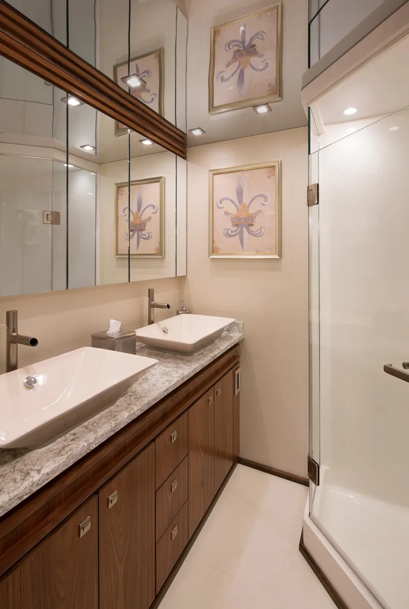 Slide: The Image of Luxurious bathroom in 2027 Viking 82 Skybridge yacht with modern fixtures and elegant decor. - 18