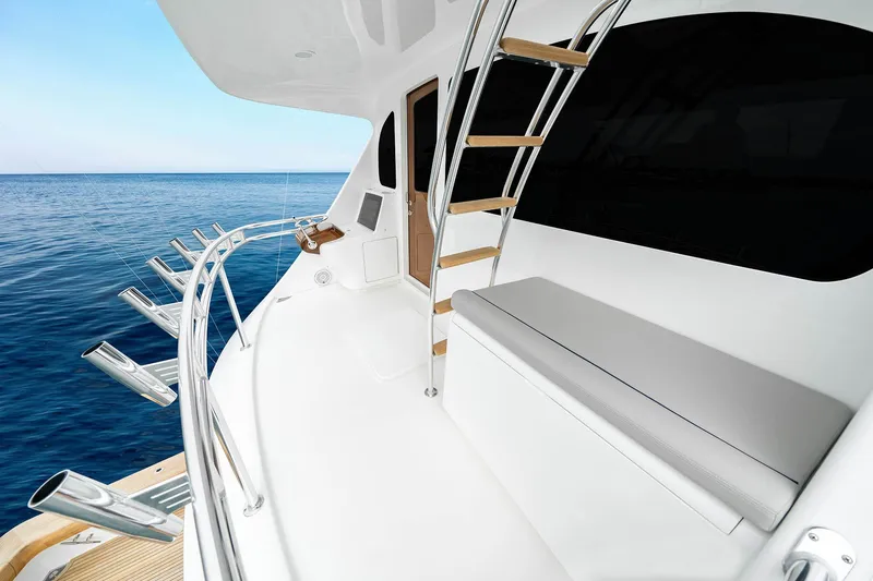 Slide: The Image of Luxury Viking 82 Skybridge yacht deck with seating and ocean view, 2027 model. - 23