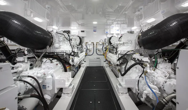 Slide: The Image of Engine room of 2027 Viking 82 Skybridge yacht, showcasing dual engines and advanced machinery. - 27
