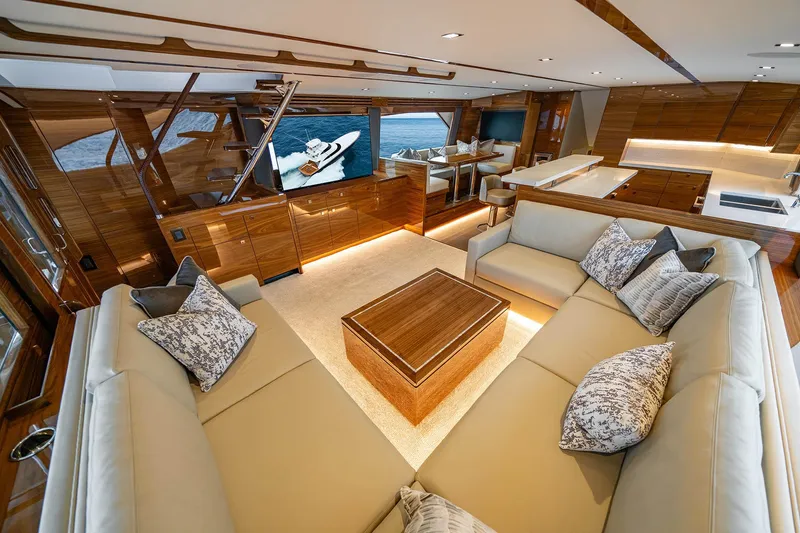 Slide: The Image of Luxurious interior of 2027 Viking 82 Skybridge yacht with elegant seating and modern amenities. - 8
