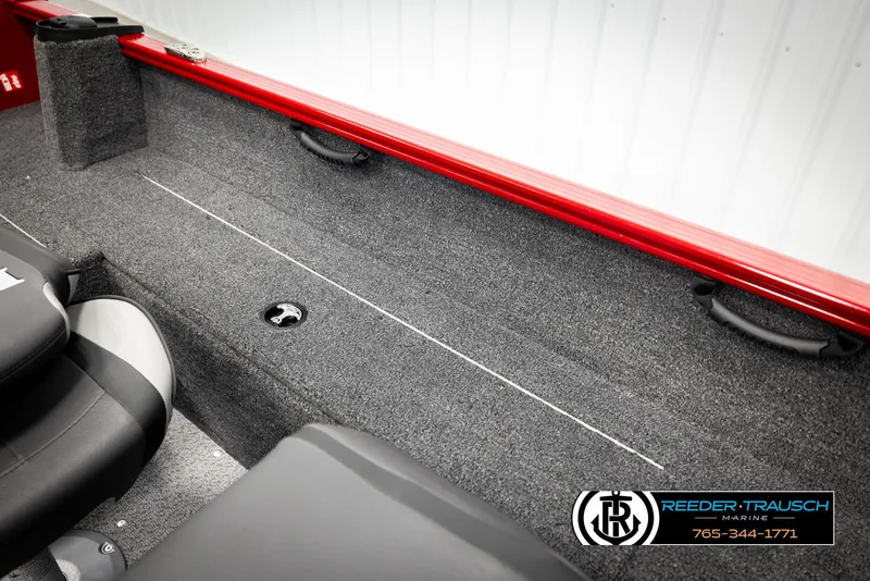 Slide: The Image of 2026 Lund 1650 Rebel XL SS boat interior with red trim and carpeted seating area. - 19