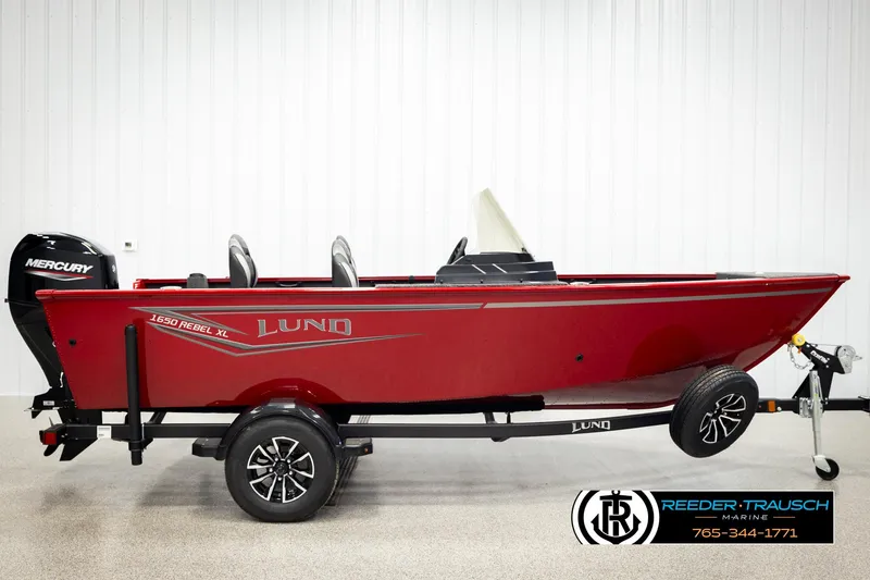 Slide: The Image of 2026 Lund 1650 Rebel XL SS boat in vibrant red on trailer, side view. - 2