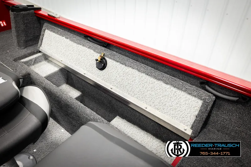 Slide: The Image of 2026 Lund 1650 Rebel XL SS boat interior with storage compartment and seating. - 20