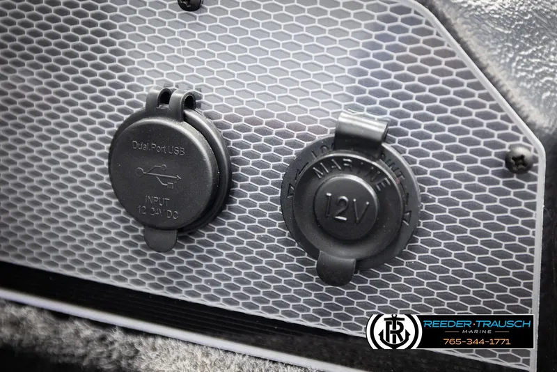 Slide: The Image of 2026 Lund 1650 Rebel XL SS boat with dual USB and 12V marine ports. - 32