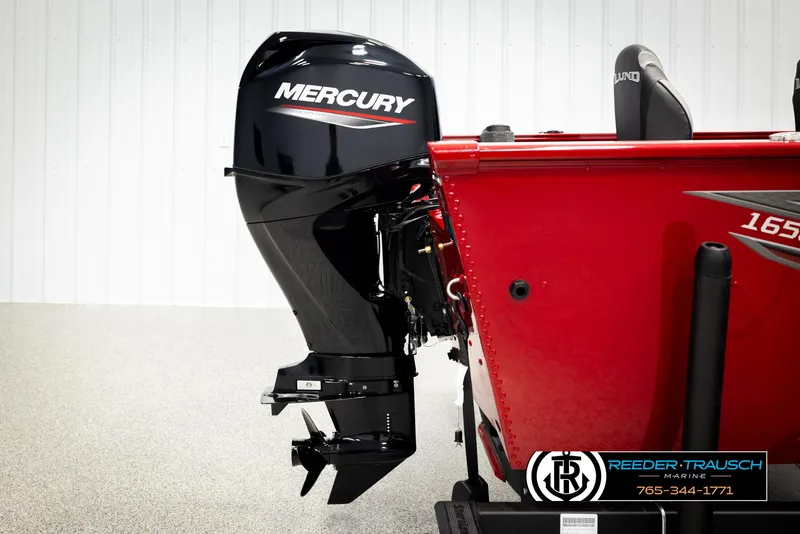 Slide: The Image of 2026 Lund 1650 Rebel XL SS boat with Mercury outboard motor, red exterior. - 38