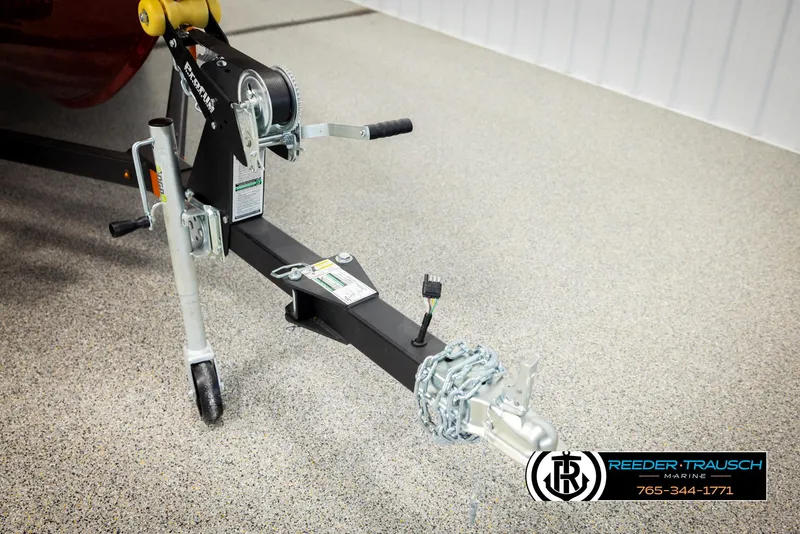 Slide: The Image of Trailer hitch of 2026 Lund 1650 Rebel XL SS with winch and chain on showroom floor. - 43