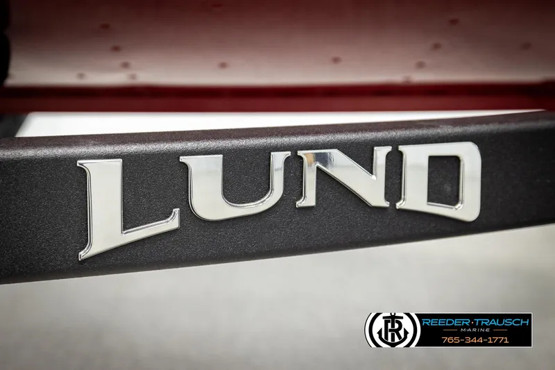 Slide: The Image of 2026 Lund 1650 Rebel XL SS logo on boat trailer, Reeder-Trausch Marine branding. - 45