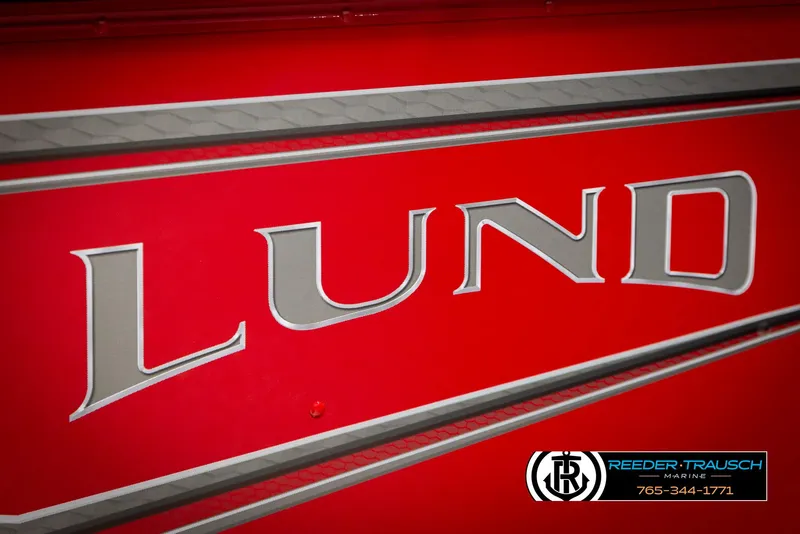 Slide: The Image of Red Lund 1650 Rebel XL SS boat, 2026 model, with Reeder-Trausch Marine branding. - 46