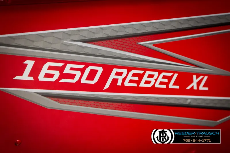 Slide: The Image of 2026 Lund 1650 Rebel XL SS boat logo on vibrant red background. - 47