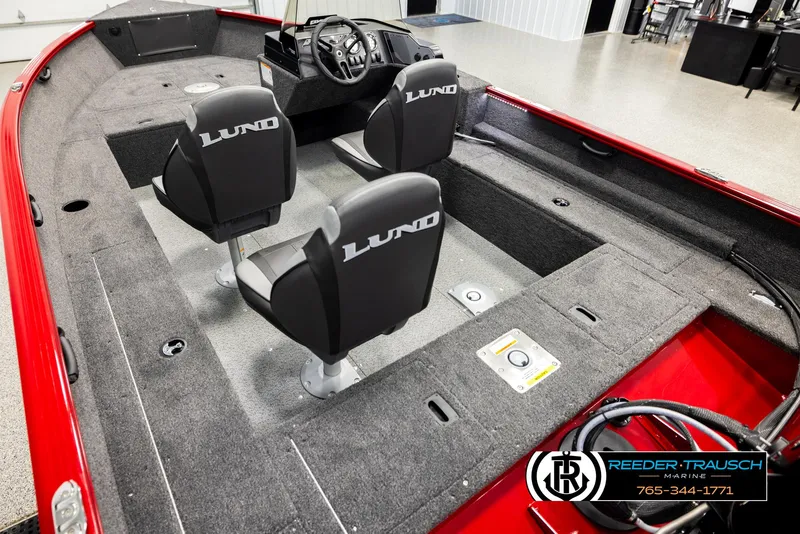 Slide: The Image of 2026 Lund 1650 Rebel XL SS boat interior with three seats and steering console. - 8