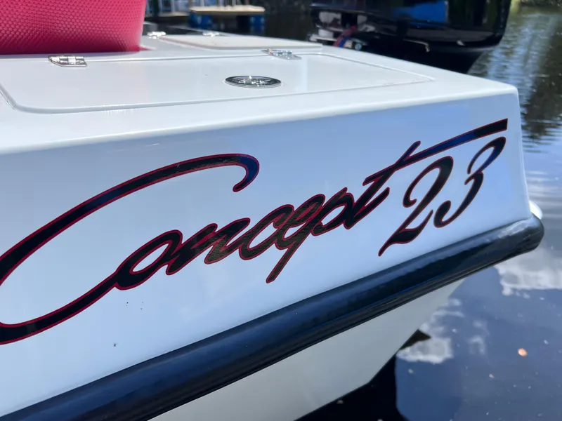 Slide: The Image of Concept 23 boat model, year 2000, with sleek design and reflective lettering. - 10