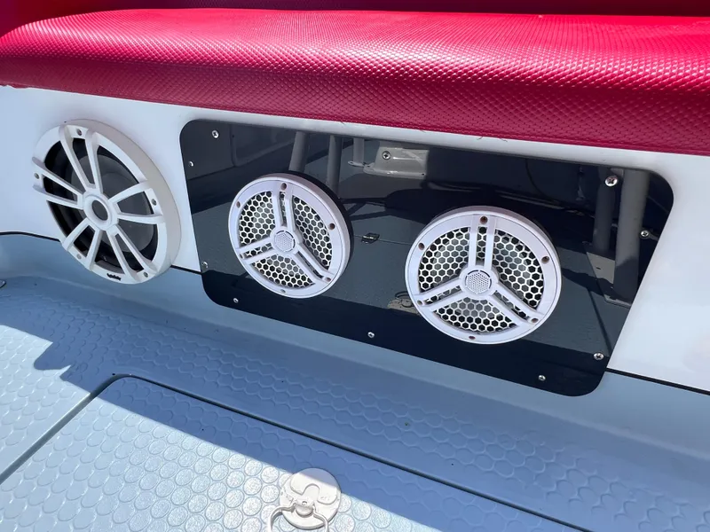 Slide: The Image of Boat audio system with three speakers, red seating, and textured flooring, Concept 23, 2000 model. - 16