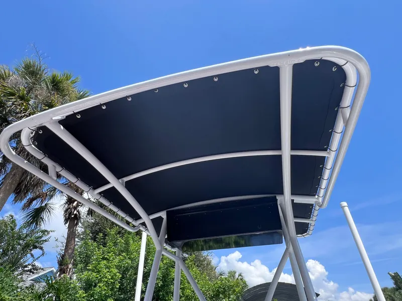 Slide: The Image of Boat canopy with white frame under clear blue sky, Concept 23 model, year 2000. - 19