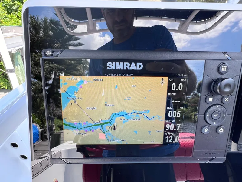 Slide: The Image of Simrad navigation display on Concept 23 boat, showing map and data. - 23