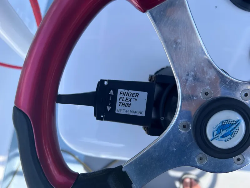 Slide: The Image of Steering wheel with Finger Flex Trim control by TH Marine, Concept 23 model, year 2000. - 25