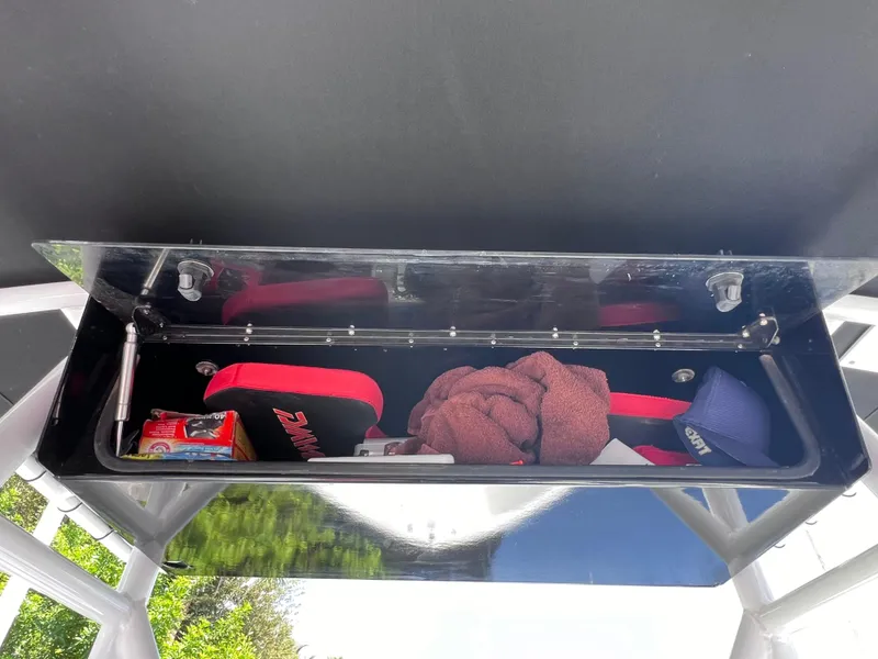 Slide: The Image of Open storage compartment in Concept 23, 2000 model, with various items inside. - 26