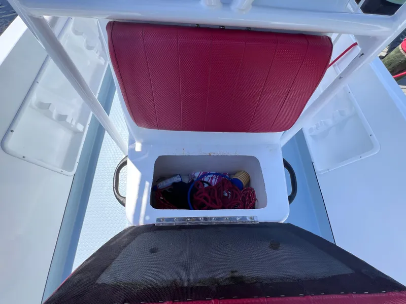 Slide: The Image of Red seat storage compartment on Concept 23 boat, year 2000, with ropes and accessories. - 28