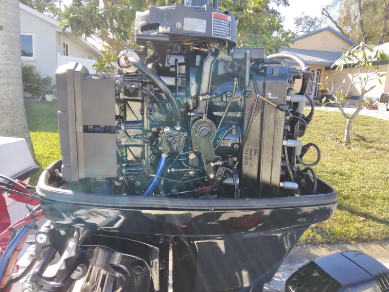 Slide: The Image of Close-up of a Concept 23 outboard motor, model year 2000, in a residential setting. - 32