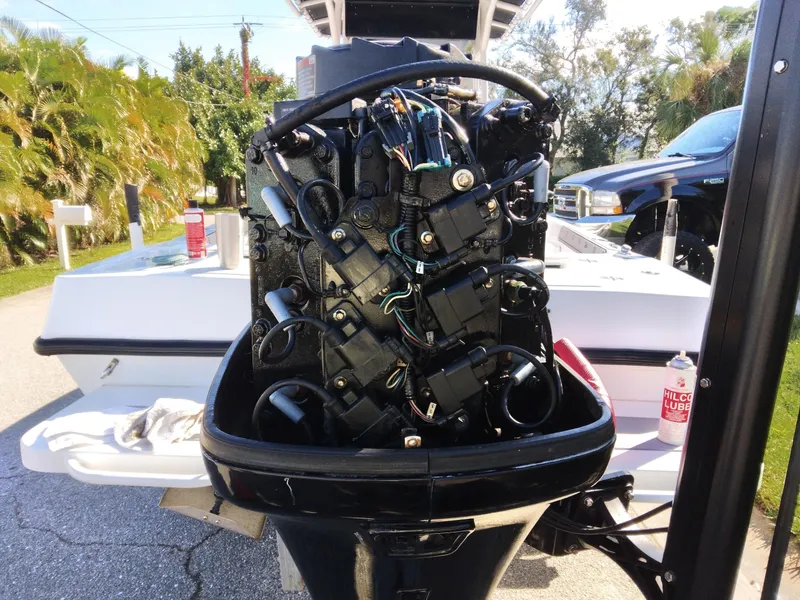 Slide: The Image of Outboard motor engine of Concept 23 boat, 2000 model, with visible wiring and components. - 33