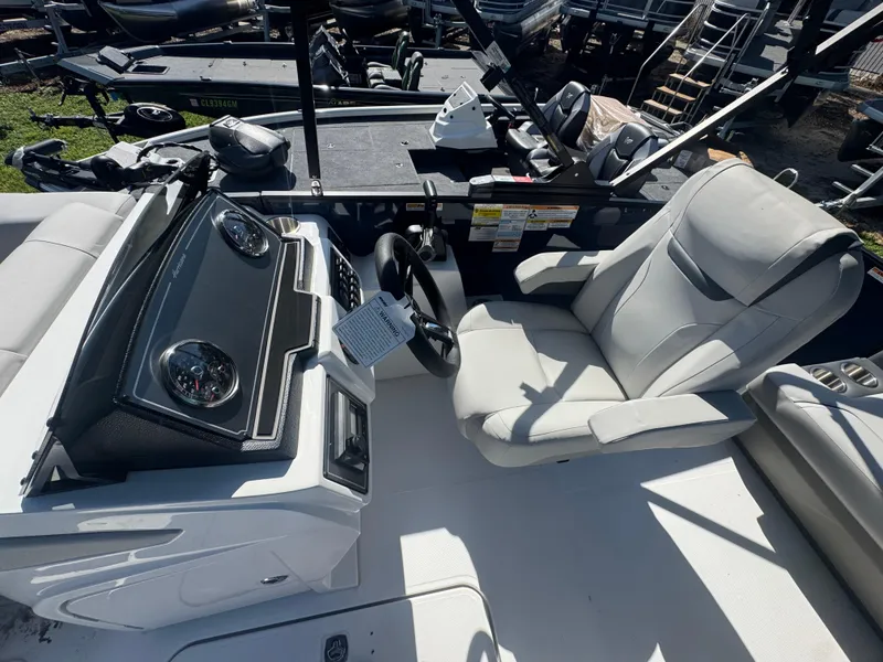 Slide: The Image of 2026 Hurricane FunDeck 1960 RE OB boat interior with steering wheel and captain's chair. - 10