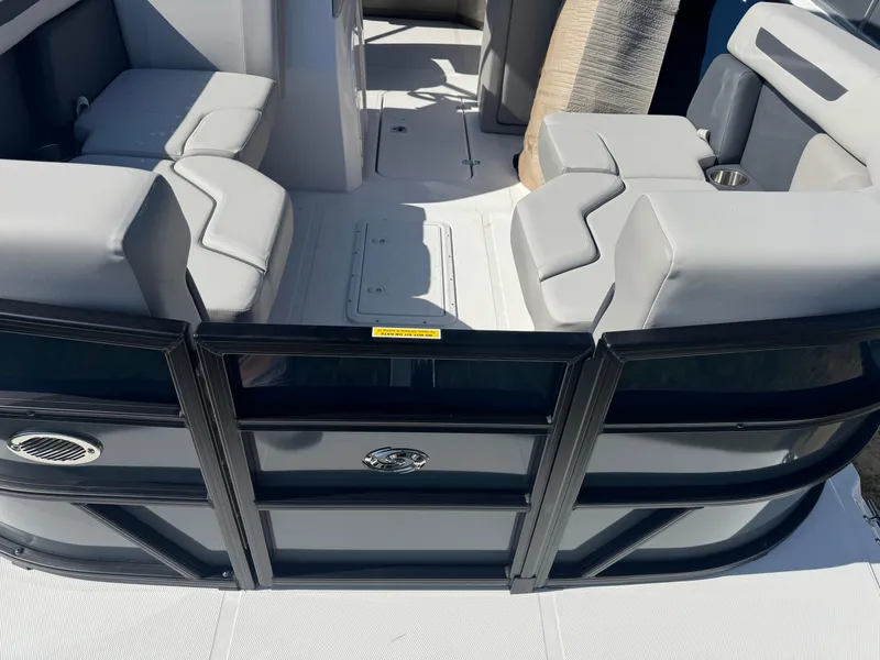 Slide: The Image of 2026 Hurricane FunDeck 1960 RE OB boat interior with gray seating and sleek design. - 13