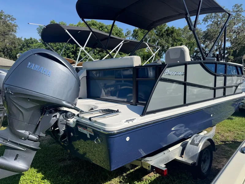 Slide: The Image of 2026 Hurricane FunDeck 1960 RE OB boat with Yamaha outboard motor on trailer. - 2
