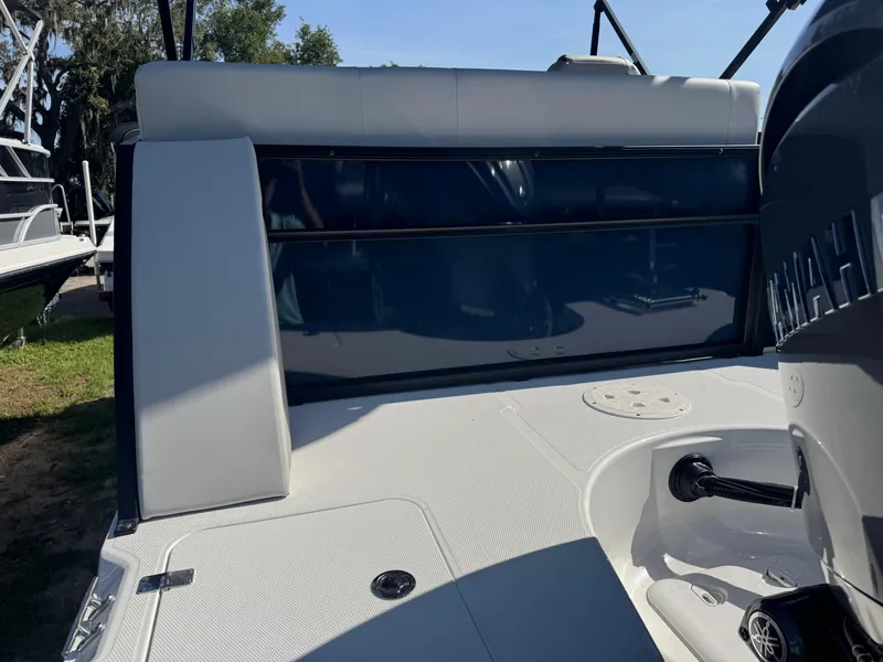 Slide: The Image of 2026 Hurricane FunDeck 1960 RE OB boat deck with Yamaha engine, outdoor setting. - 6