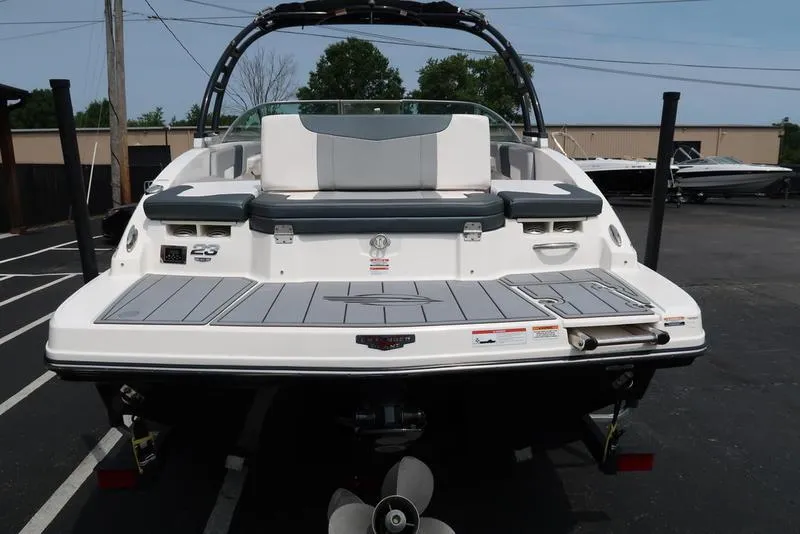 Slide: The Image of 2021 Chaparral 23 SSi boat rear view, showcasing swim platform and seating. - 10